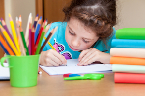 Girl writing at a desk