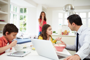 Family Using Digital Devices Having Argument Over Breakfast